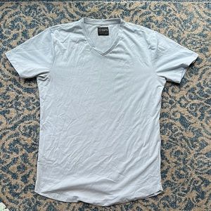 Cuts V neck AO curve hem light blue size medium